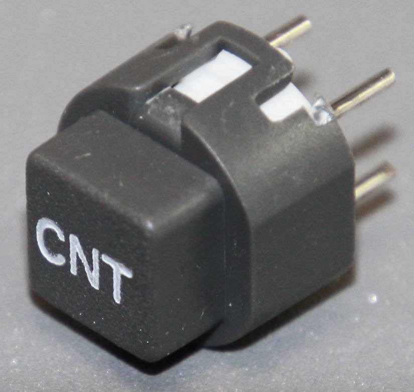 Tryktast med påskrift "CNT"