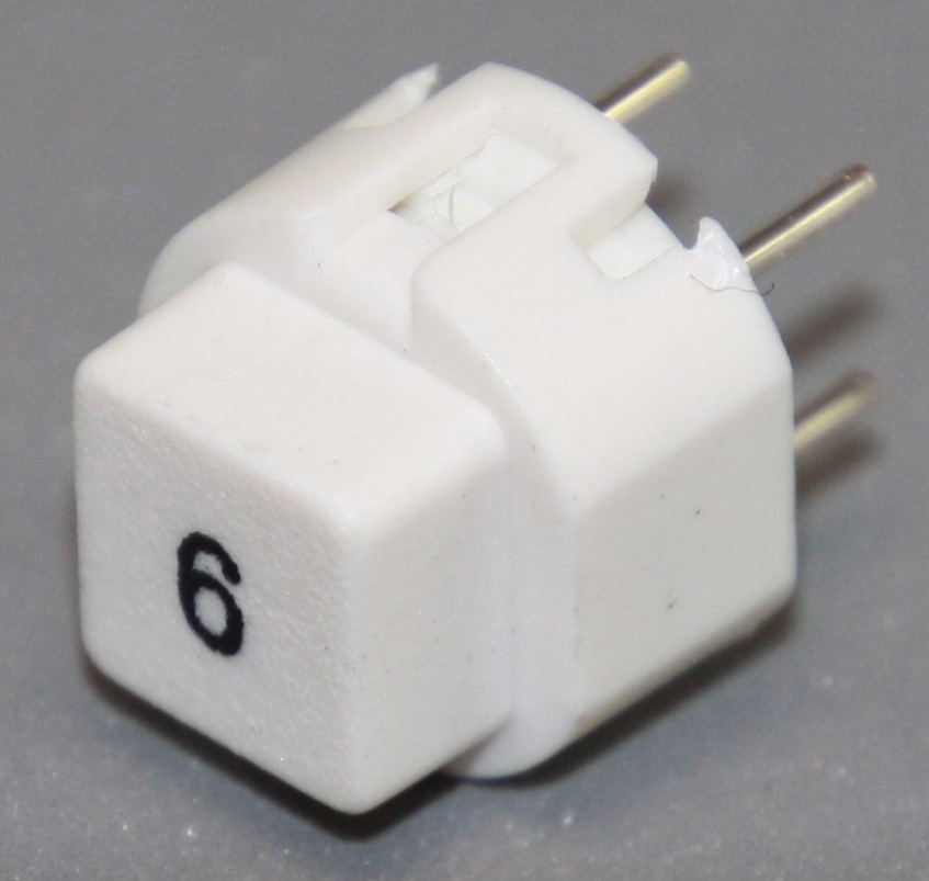 Tryktast med påskrift "6"