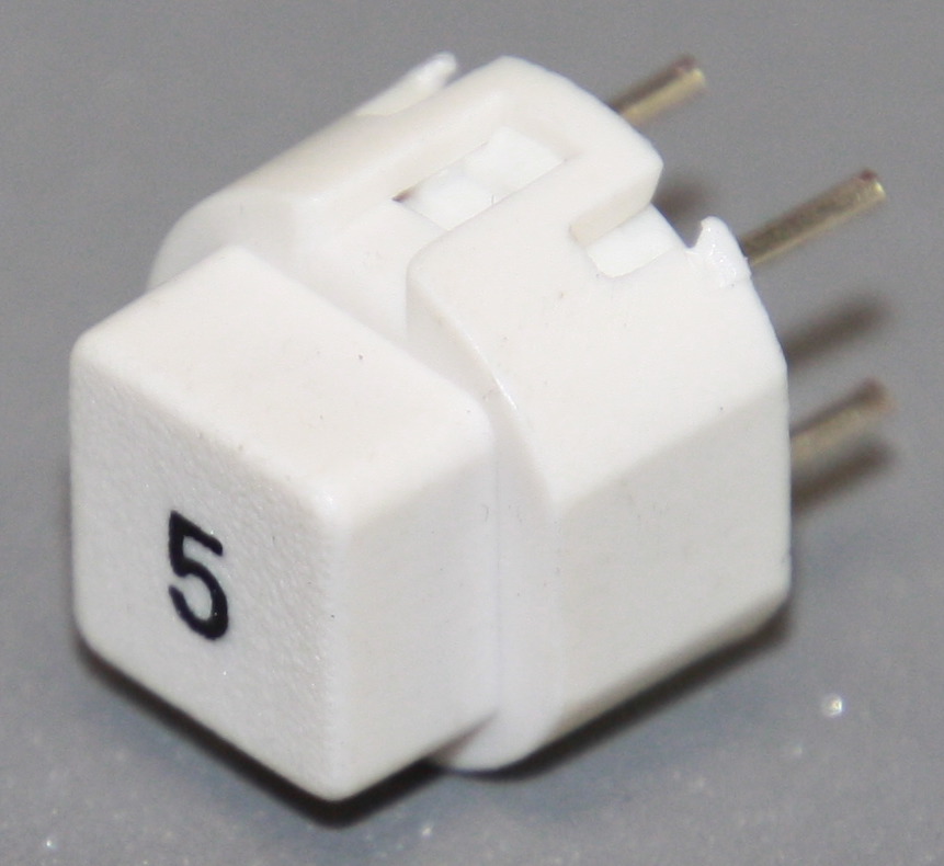 Tryktast med påskrift "5"