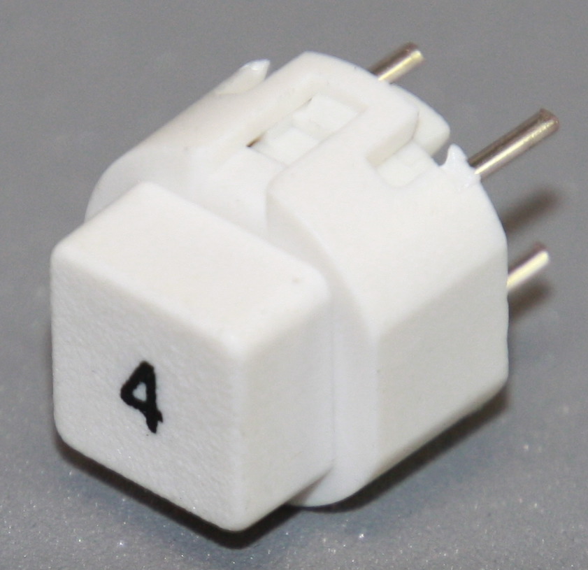 Tryktast med påskrift "4"